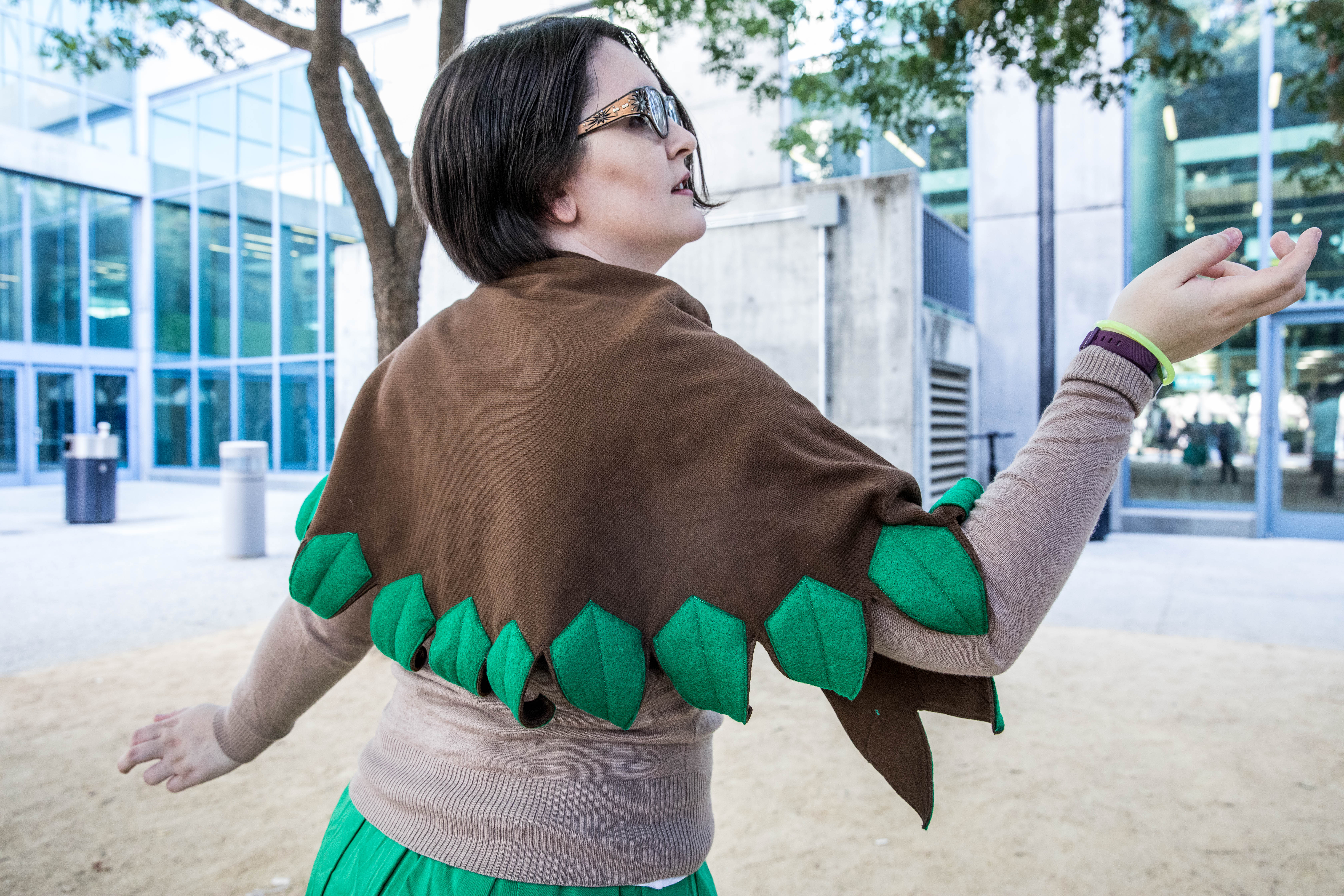 Rowlet Schoolgirl posing with back to camera, showing off leaf shawl.