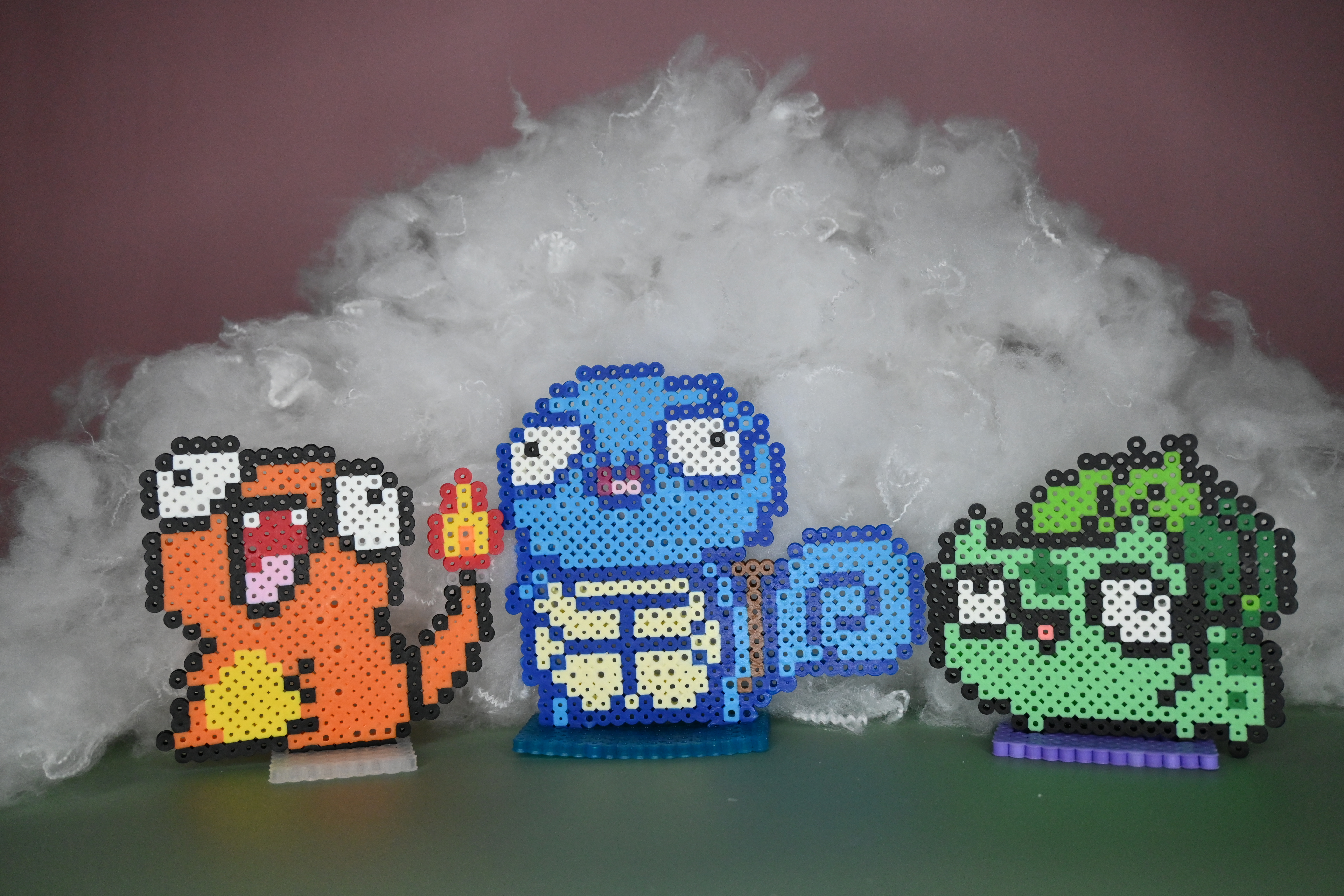 Charmander, Squirtle and Bulbasaur Derp Designs made out of Perler brand fuse beads.