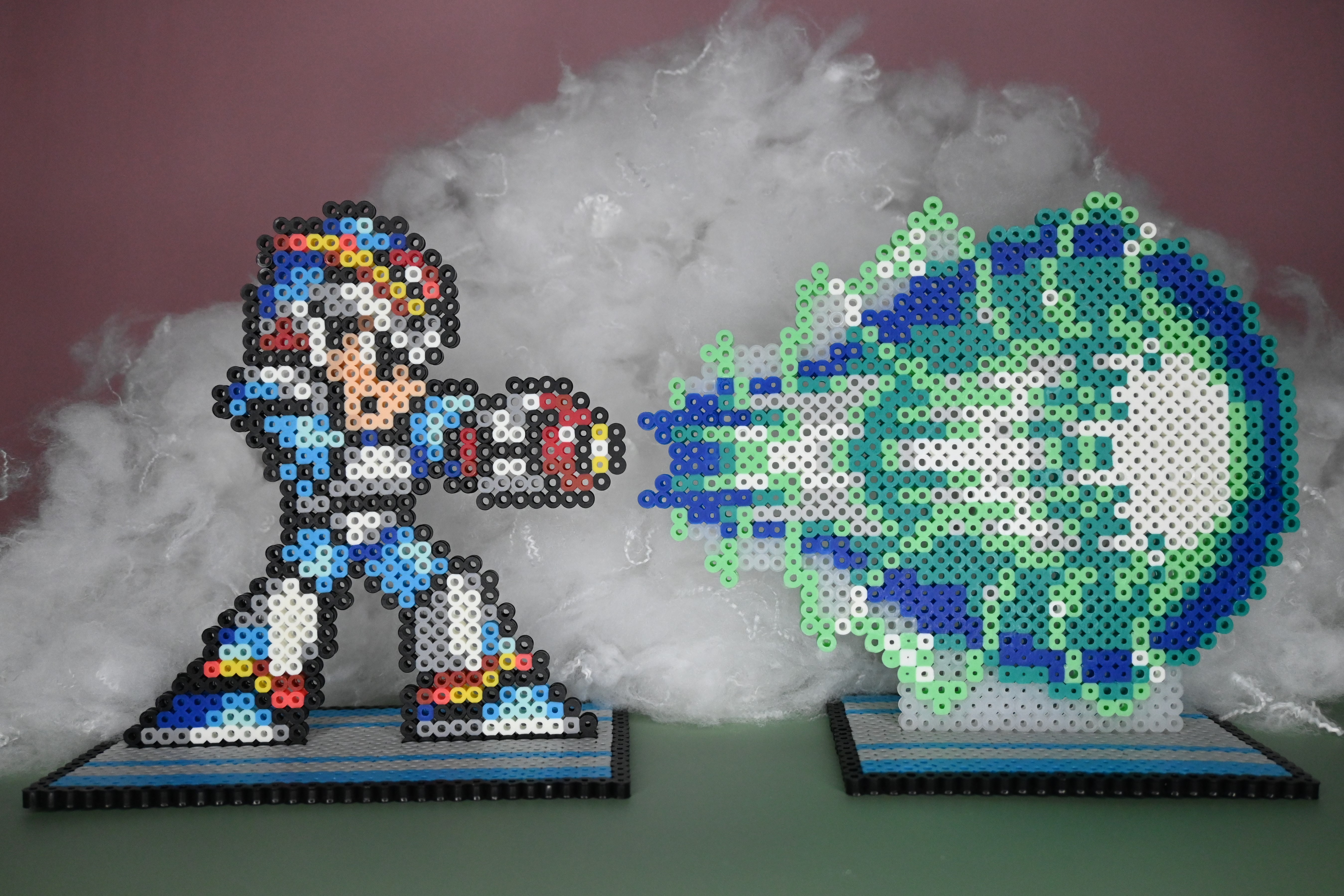 Megaman and charge shot made out of Perler brand fuse beads.